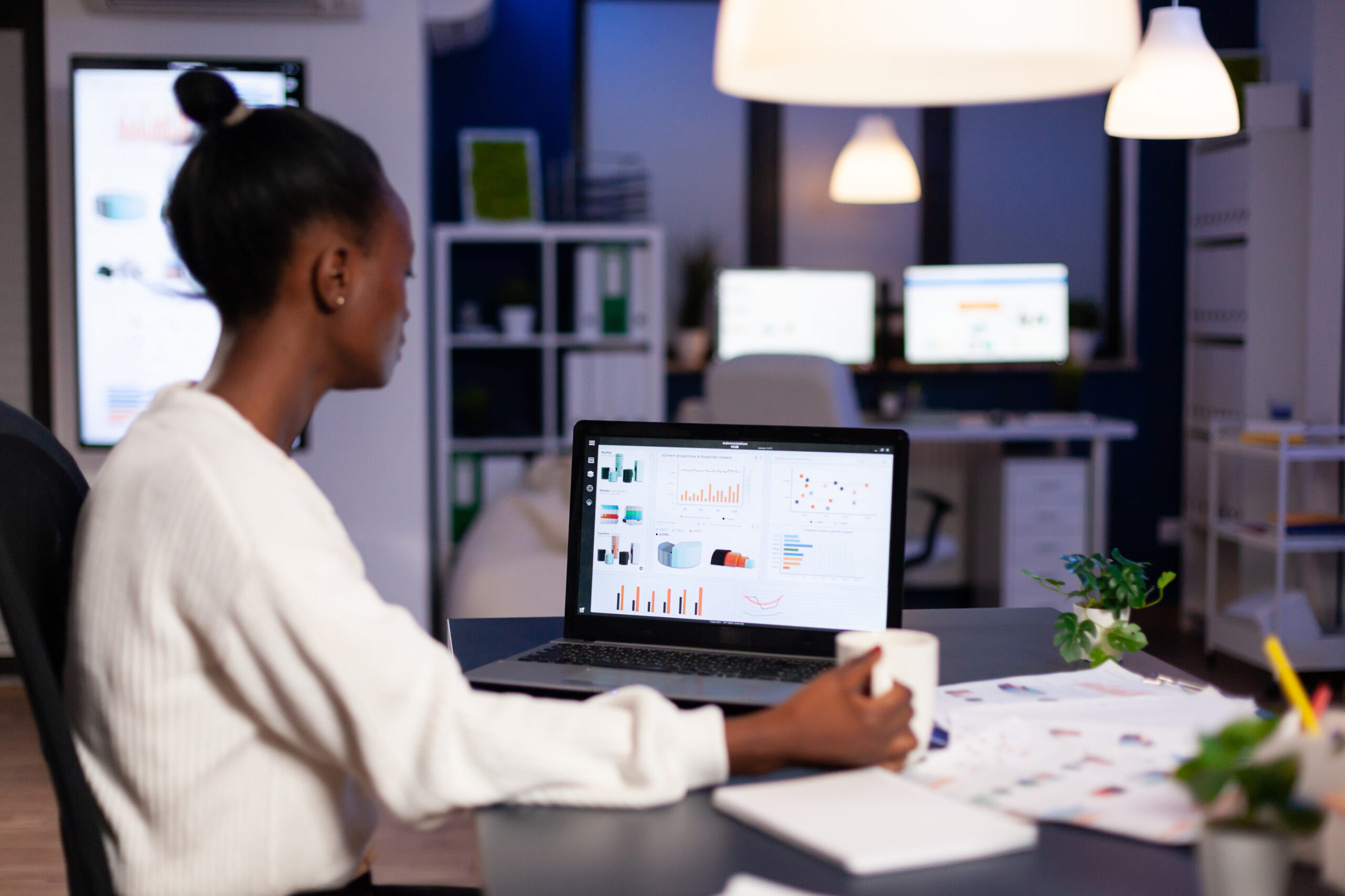 Business woman going over digital financial stats